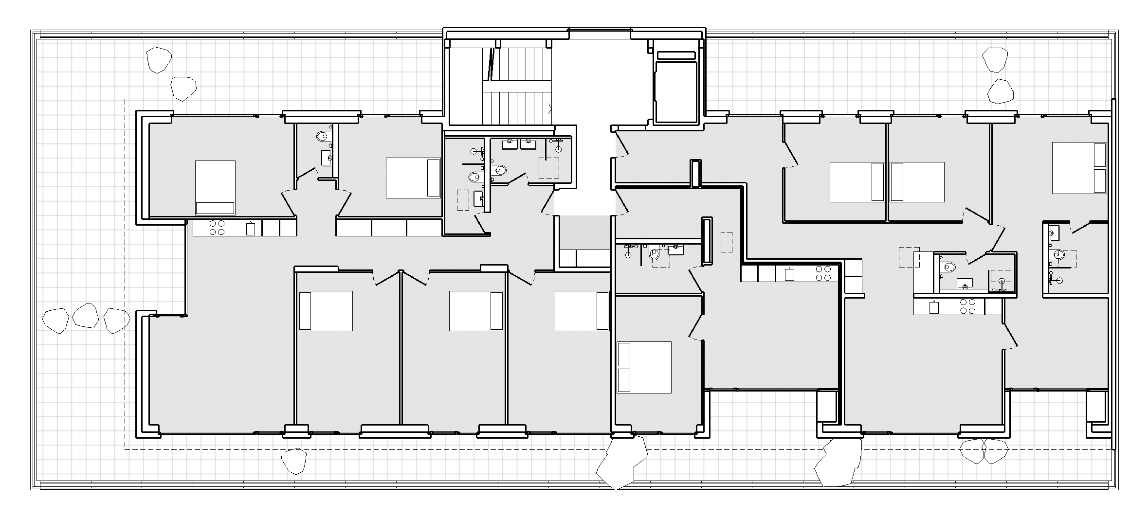 Umbau, Umnutzung und Wettbewerb von KGRUPPE Architekten Basel - Grundriss eines Wohngebäudes mit mehreren Zimmern, Küchen und Badezimmern, verbunden durch einen zentralen Korridor.